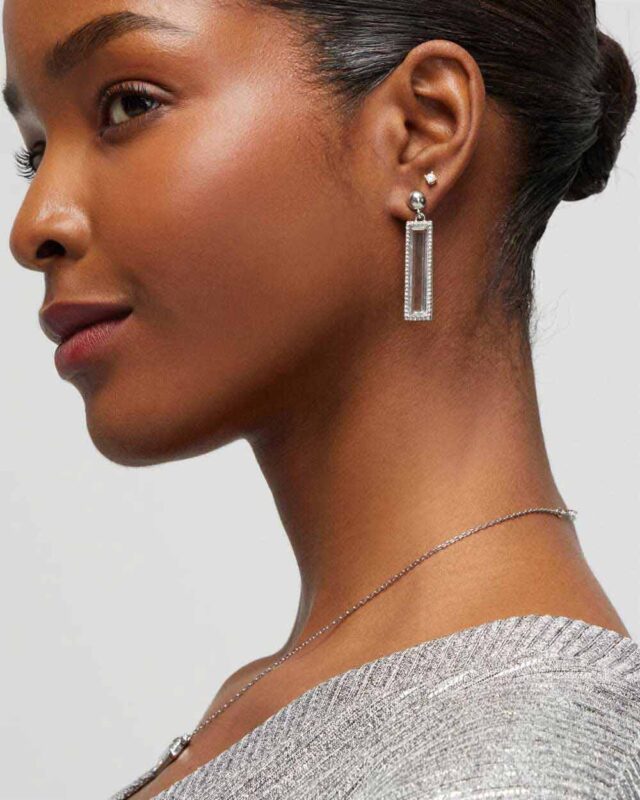 Model wearing glass earrings